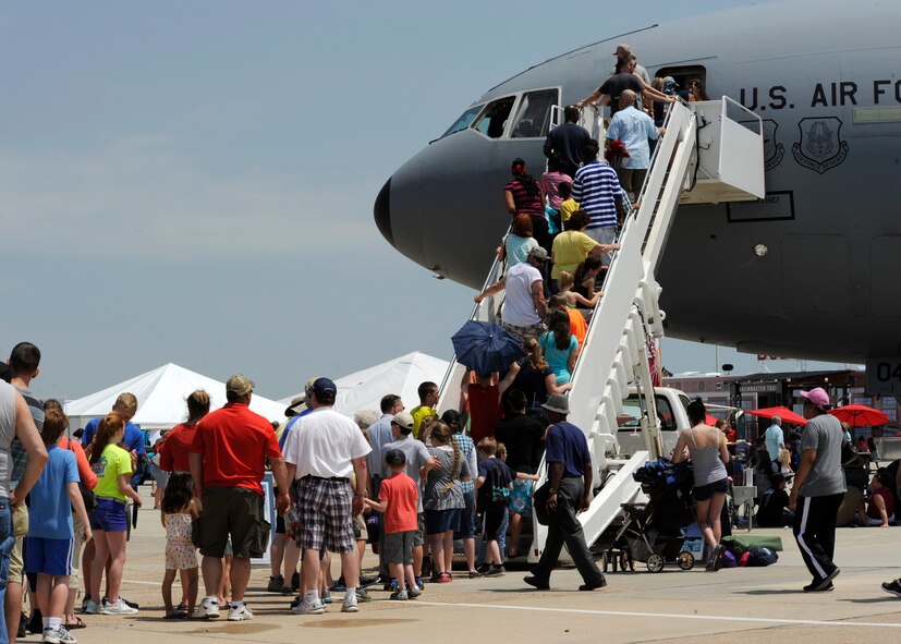 Spectators enter a C-17 Globemaster III from Altus Air Force Base, Okla., during the Defenders of Liberty Air Show on Barksdale Air Force Base, La., April 26, 2014. The C-17 is the newest, most flexible cargo aircraft to enter the airlift force. The C-17 is capable of rapid strategic delivery of troops and all types of cargo to main operating bases or directly to forward bases in the deployment area. (U.S. Air Force photo/Senior Airman Joseph A. Pag?n Jr.)