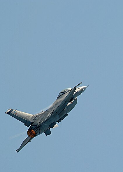 An F-16 Fighting Falcon flies over the flightline during the Defenders of Liberty Air Show on Barksdale Air Force Base, La. April 25, 2014. The F-16 is a compact, multi-role fighter aircraft. It is highly maneuverable and has proven itself in air-to-air combat and air-to-surface attack. (U.S. Air Force photo/Senior Airman Joseph A. Pag?n Jr.)