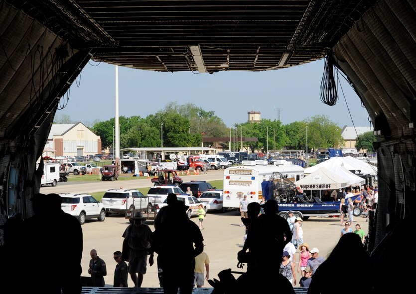 Spectators enter the front of a C-5B Galaxy from the 439th Airlift Wing, Westover Air Reserve Base, Mass., during the Defenders of Liberty Air Show on Barksdale Air Force Base, La., April 26, 2014. The C-5 is one of the largest aircraft in the world and the largest airlifter in the Air Force inventory. The aircraft can carry a fully equipped combat-ready military unit to any point in the world on short notice and then provide the supplies required to help sustain the fighting force. (U.S. Air Force photo/Senior Airman Joseph A. Pag?n Jr.)