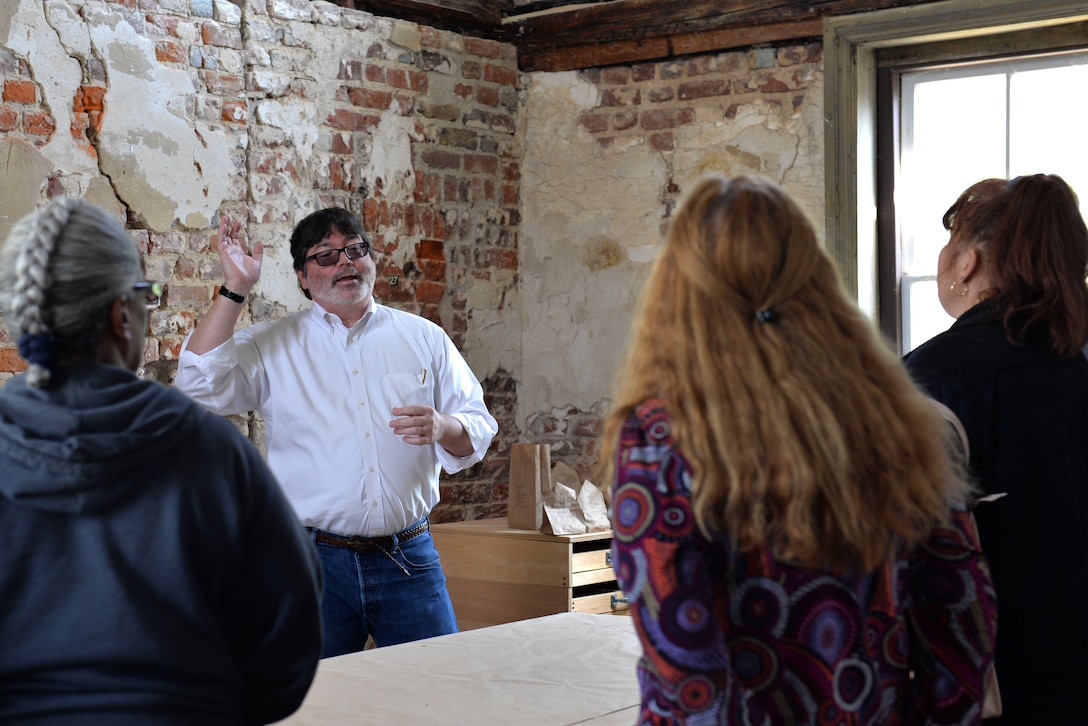 Christopher McDaid, 733rd Civil Engineer division environmental element archaeologist, conducts a tour of the Matthew Jones House as part of the annual Earth Week celebration at Fort Eustis, Va., April 25, 2014.  Built in 1700, the house is the oldest building owned by the Department of Defense in the United States. (U.S. Air Force photo by Senior Airman Teresa J.C. Aber/Released)