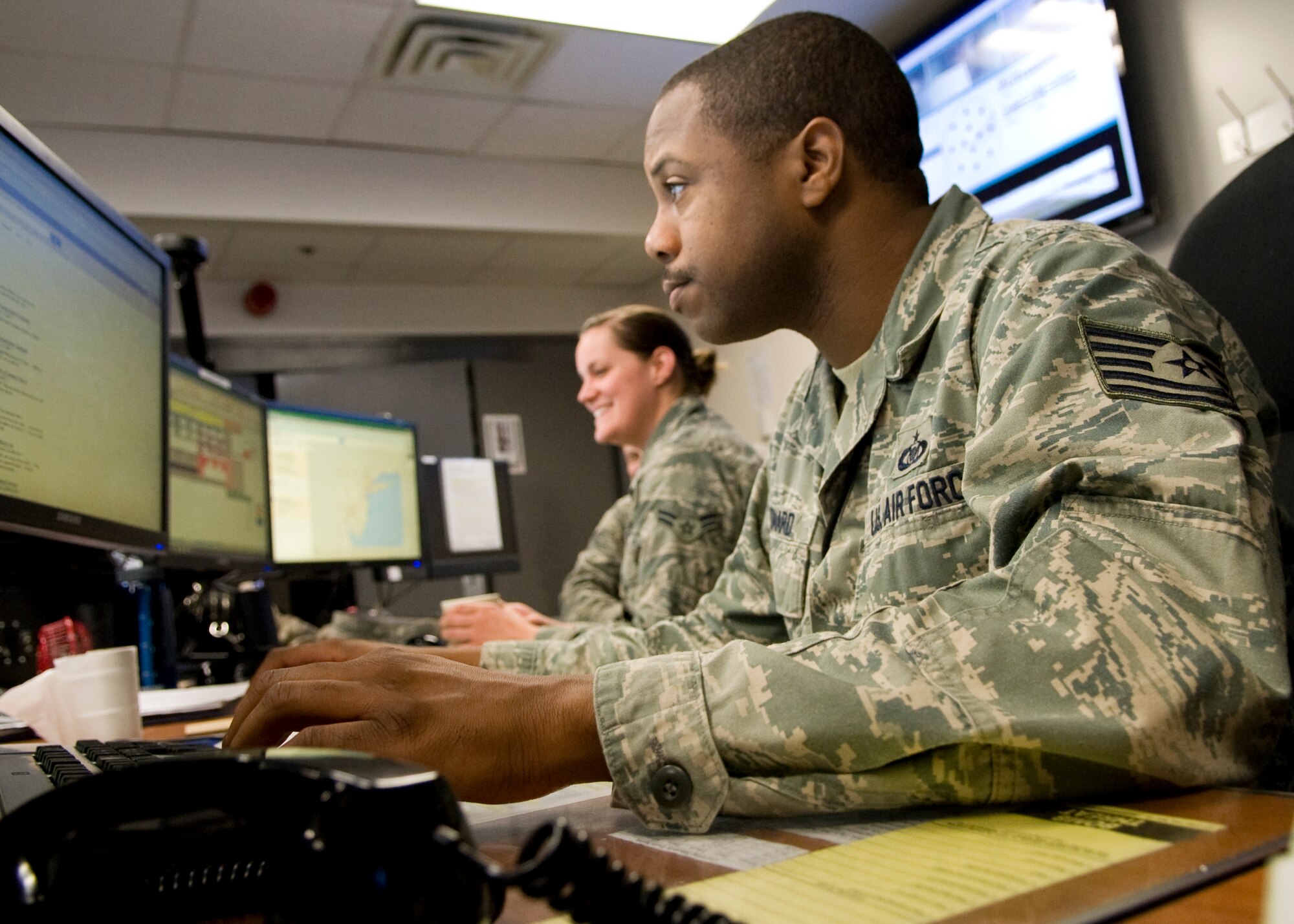 Tech. Sgt. Andre Leonard, 436th Airlift Wing Command Post NCO in charge of training, monitors command and control systems April 22, 2014, inside the command post on Dover Air Force Base, Del. The 436th AW/CP won the 2013 Air Mobility Command Large Command Post of the Year Award. (U.S. Air Force photo/Airman 1st Class Zachary Cacicia)