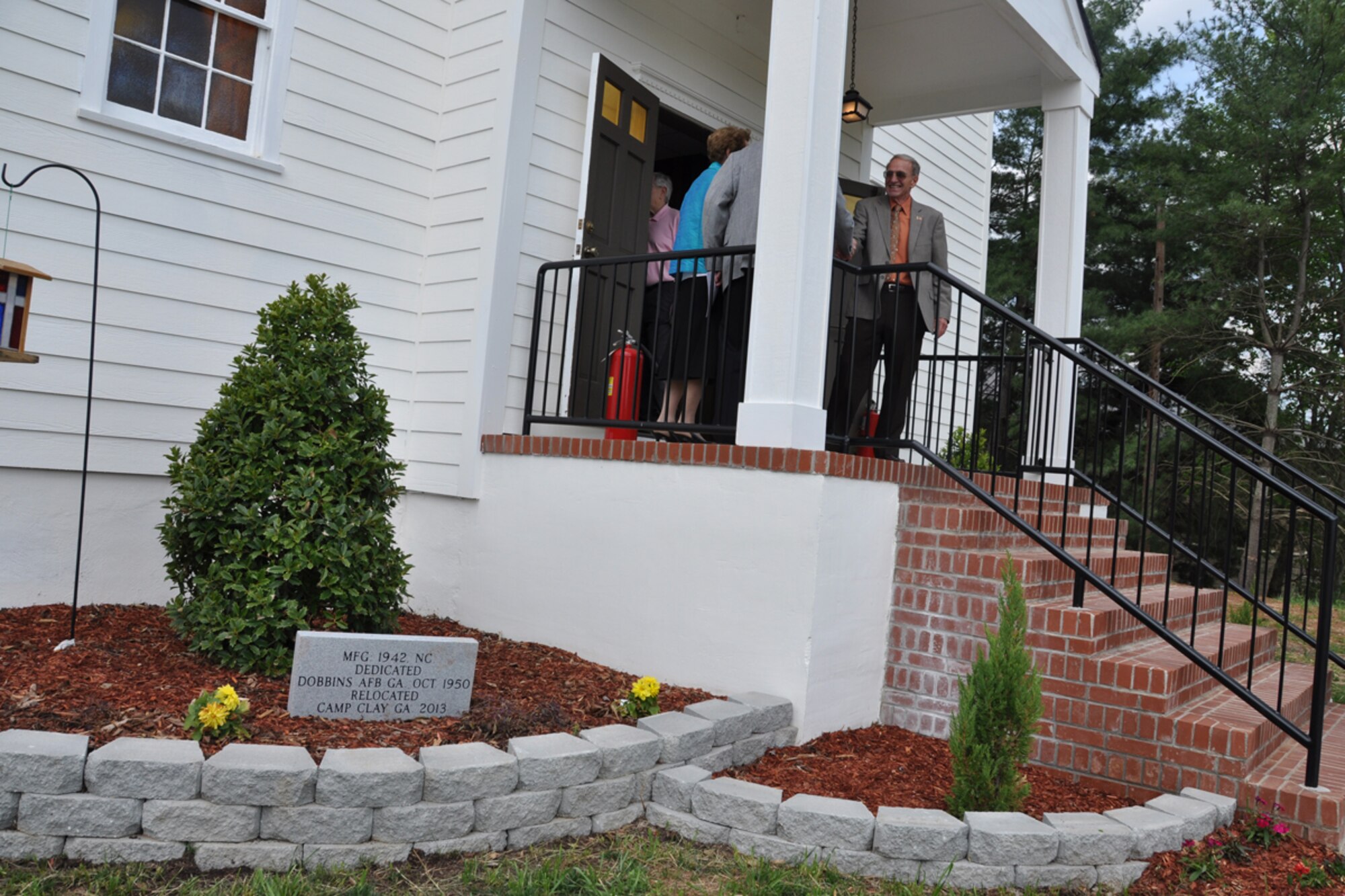 The historic Dobbins chapel was signed over to the Gen. Lucius D. Clay National Guard Center during a Rededication and Transfer of Ownership Ceremony at the Gen. Lucius D. Clay National Guard Center April 27. The chapel was relocated from Dobbins Air Reserve Base to the Clay NGC in March 2013. (U.S. Air Force photo/James Branch)