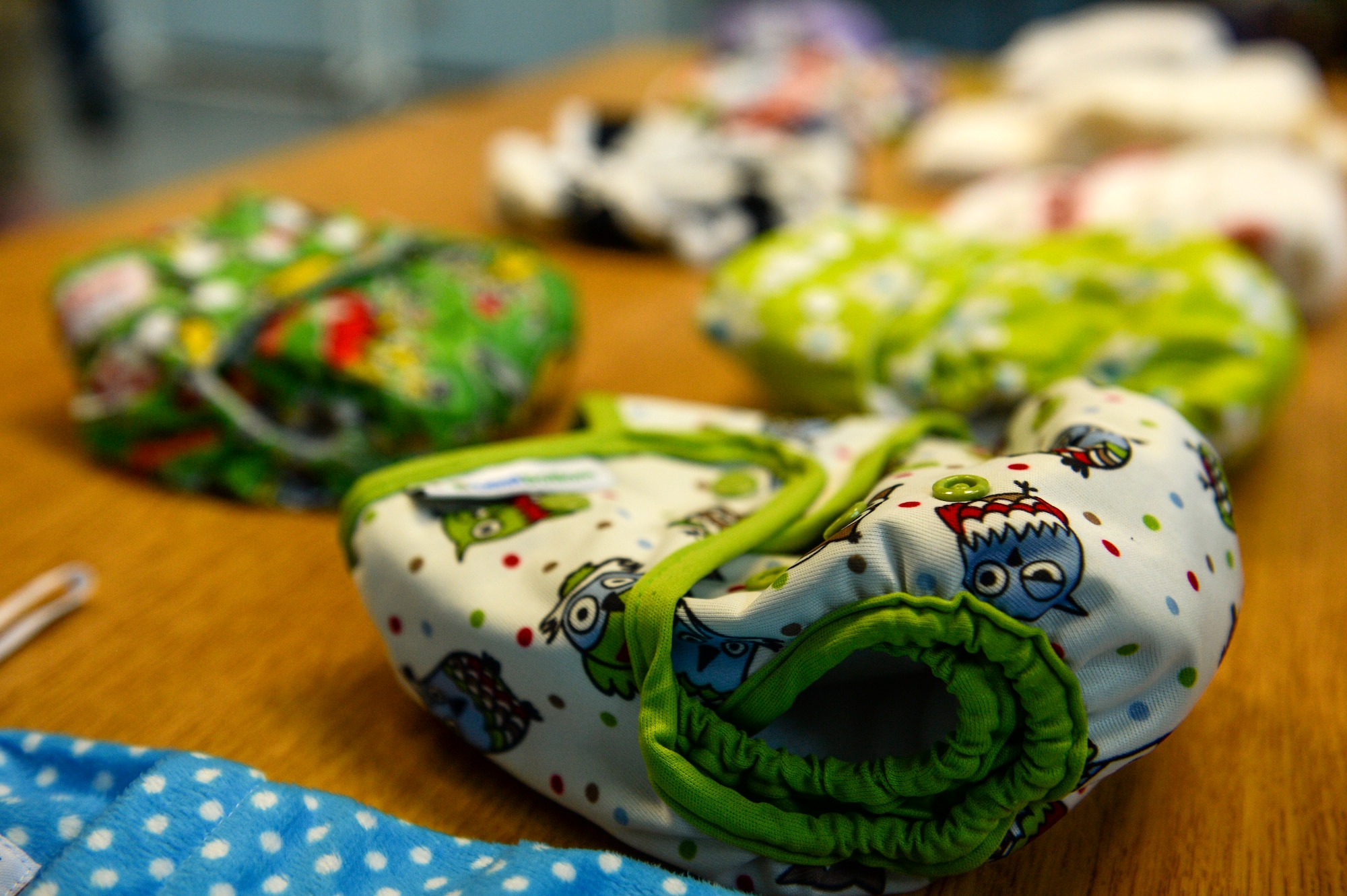 Cloth diapers are displayed on a table during the 2014 Great Cloth Diaper Change April 26, 2014, at Spangdahlem Air Base, Germany. One of the requirements for the event states that the children must be changed using a cloth diaper. (U.S. Air Force photo by Senior Airman Rusty Frank/Released)