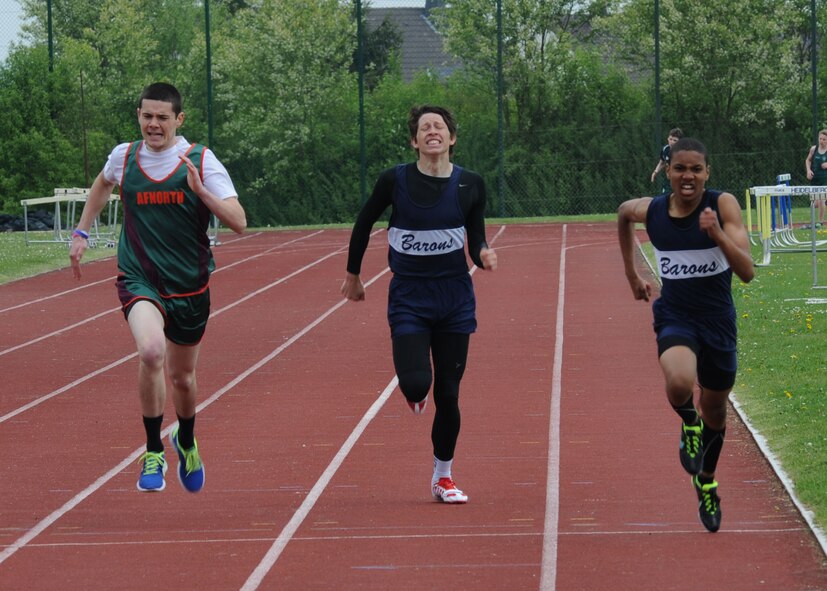 Three competitors sprint the final stretch of an 800-meter race during the Bitburg Middle High School track meet April 26, 2014, at the school track on Bitburg Base Annex, Germany. The Bitburg Barons men’s track team won first place competing against four other schools. (U.S. Air Force photo by Airman 1st Class Dylan Nuckolls/Released)
