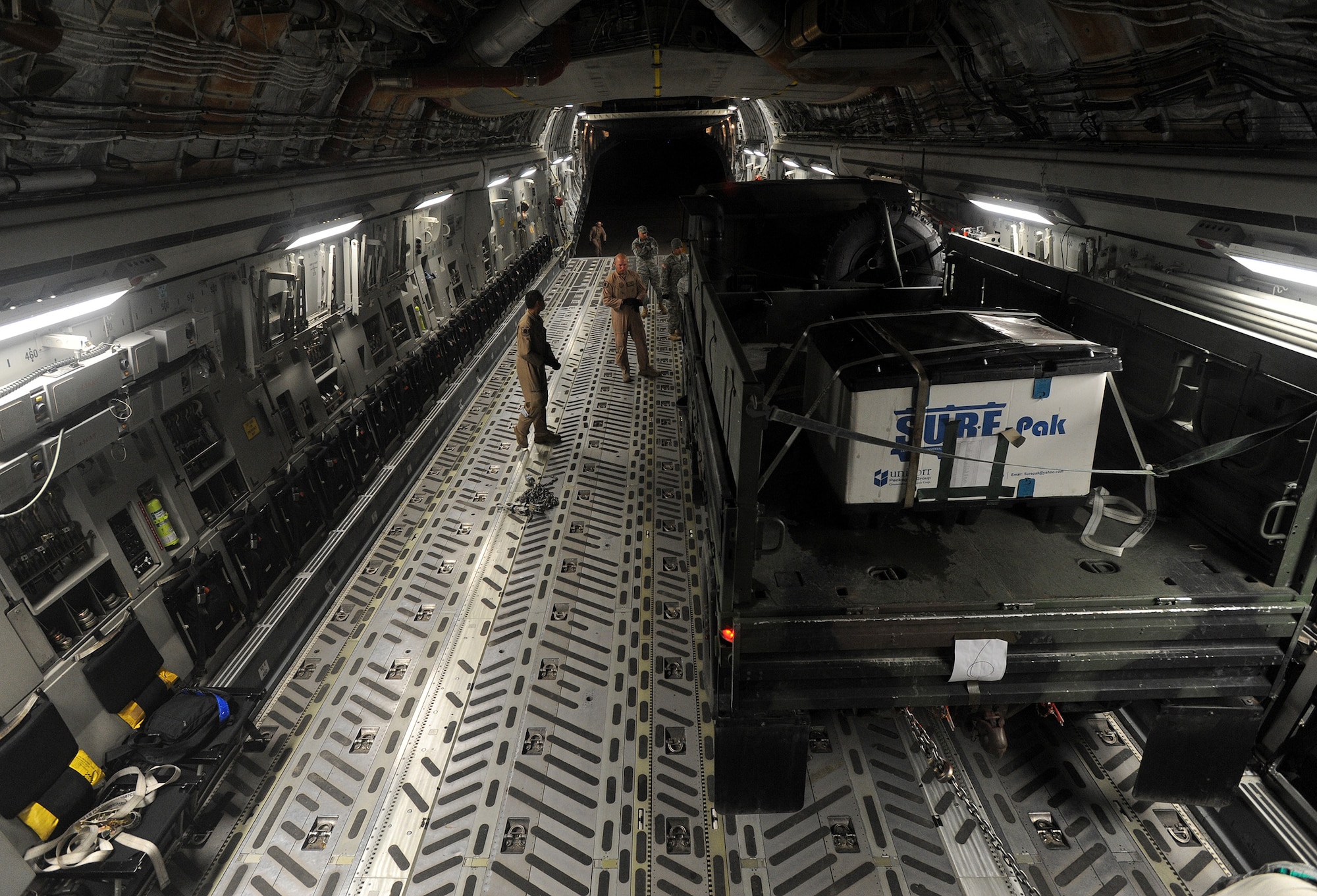 Airmen from the 724th Air Mobility Squadron prepare cargo pallets to be loaded on a C-17 Globemaster at Aviano Air Base, Italy, April 26, 2014. The C-17, from M.K. International Air Base Passenger Transit Center, Romania, transported the cargo to one of the Baltics states where U.S. Army Soldiers from the 173rd Infantry Brigade Combat Team, Airborne, out of Vicenza, Italy, will conduct joint NATO training. (U.S. Air Force photo/Staff Sgt. R.J. Biermann)