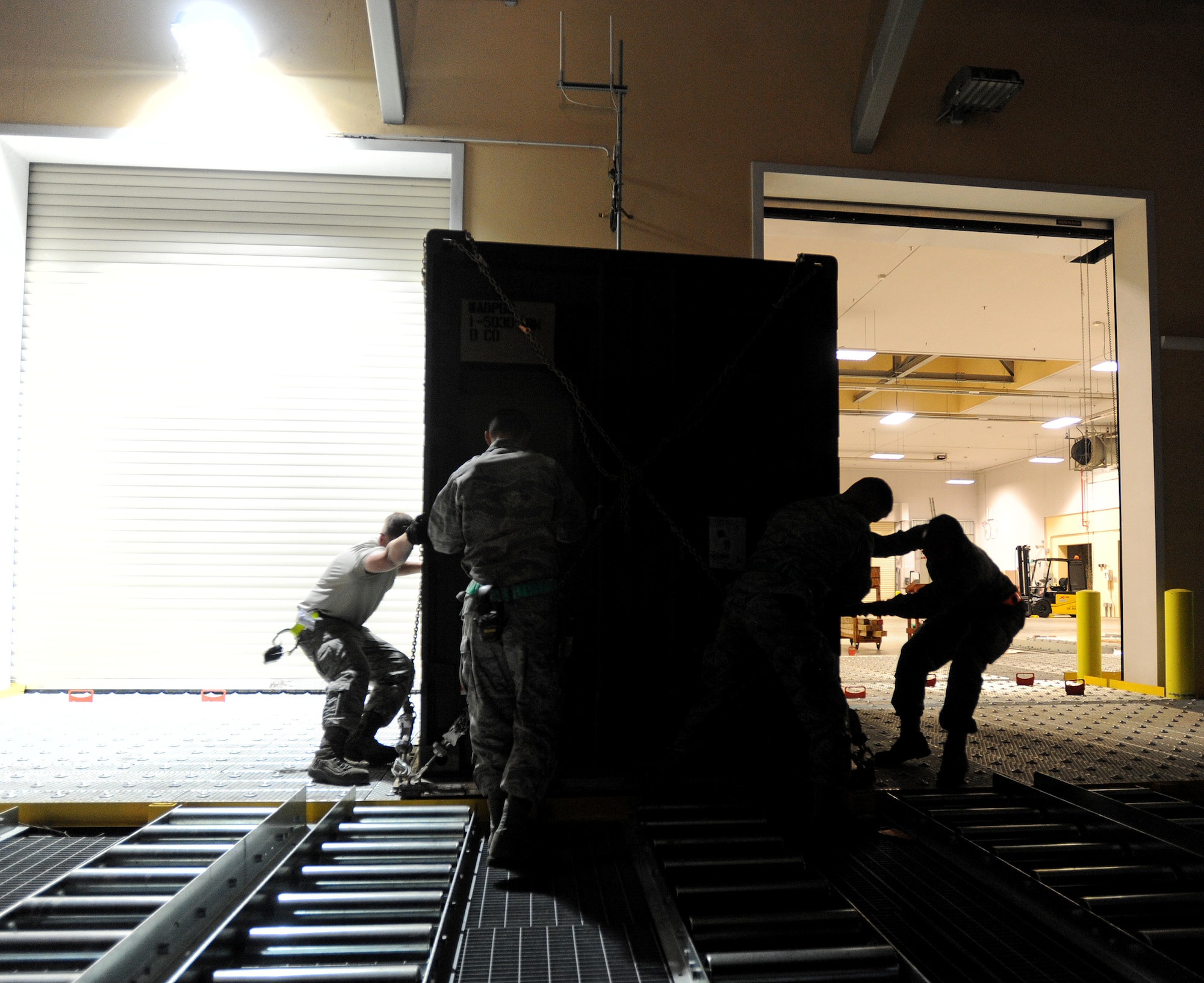 Airmen from the 724th Air Mobility Squadron prepare cargo pallets to be loaded on a C-17 Globemaster at Aviano Air Base, Italy, April 26, 2014. The C-17, from M.K. International Air Base Passenger Transit Center, Romania, transported the cargo to one of the Baltics states where U.S. Army Soldiers from the 173rd Infantry Brigade Combat Team, Airborne, out of Vicenza, Italy, will conduct joint NATO training. (U.S. Air Force photo/Staff Sgt. R.J. Biermann)