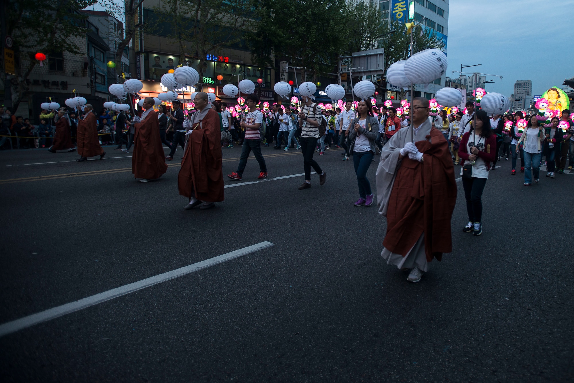 Buddhist monks march in the Lotus Lantern Festival April 26, 2014, in Seoul, Republic of Korea. The Buddhists marched to give blessings for the deceased or missing persons of the passenger ship Sewol that sank off the coast of Gwanmaedo Island April 15. (U.S. Air Force photo by Staff Sgt. Jake Barreiro)