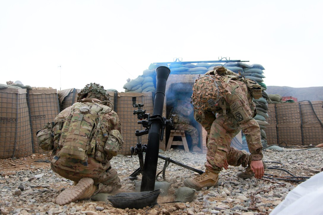 U.S. Army Pfc. Joshua Brown and U.S. Army Spc. Nicholas Morton fire an 81mm mortar round during training on Forward Operating Base Lightning in Afghanistan's Paktia province, April 25, 2014. Brown and Morton are assigned to 10th Mountain Division's 3rd Squadron, 71st Calvary Regiment, 3rd Brigade Combat Team.