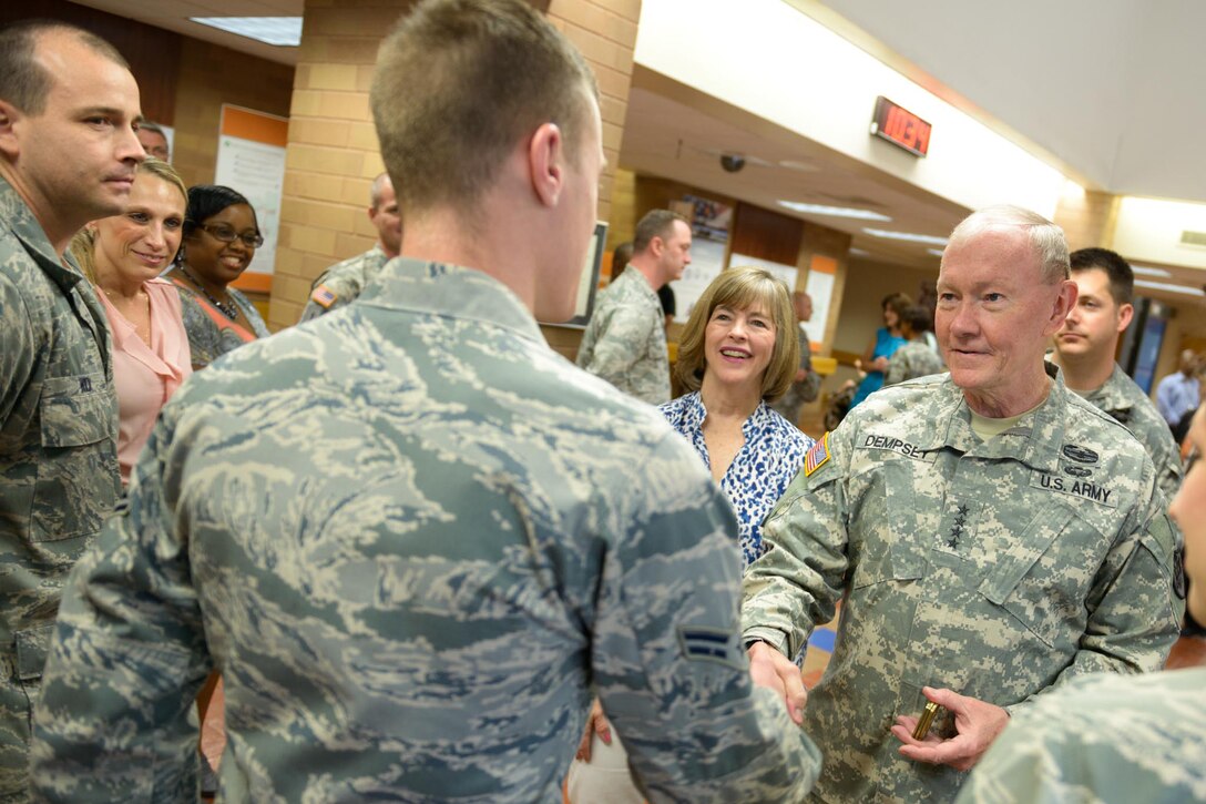 Army Gen. Martin E. Dempsey, right, chairman of the Joint Chiefs of Staff, and his wife, Deanie, meet with medical staff from Brooke Army Medical Center on Fort Sam Houston, Texas, April 25, 2014. 