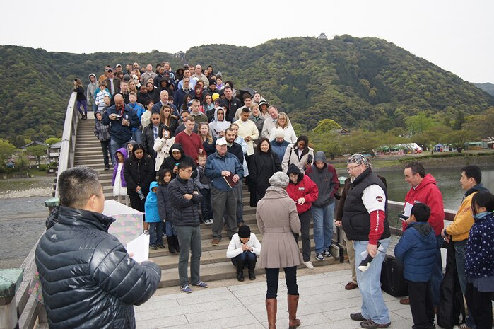 Lt. Cmdr. Louis Lee, command chaplain with the Marine Memorial Chapel, speaks to members attending the Easter Sunrise Service at the Kintai Bridge in Iwakuni, Japan, April 20, 2014. The purpose of the service was to reflect on the principles of Easter and to bring the community closer together.