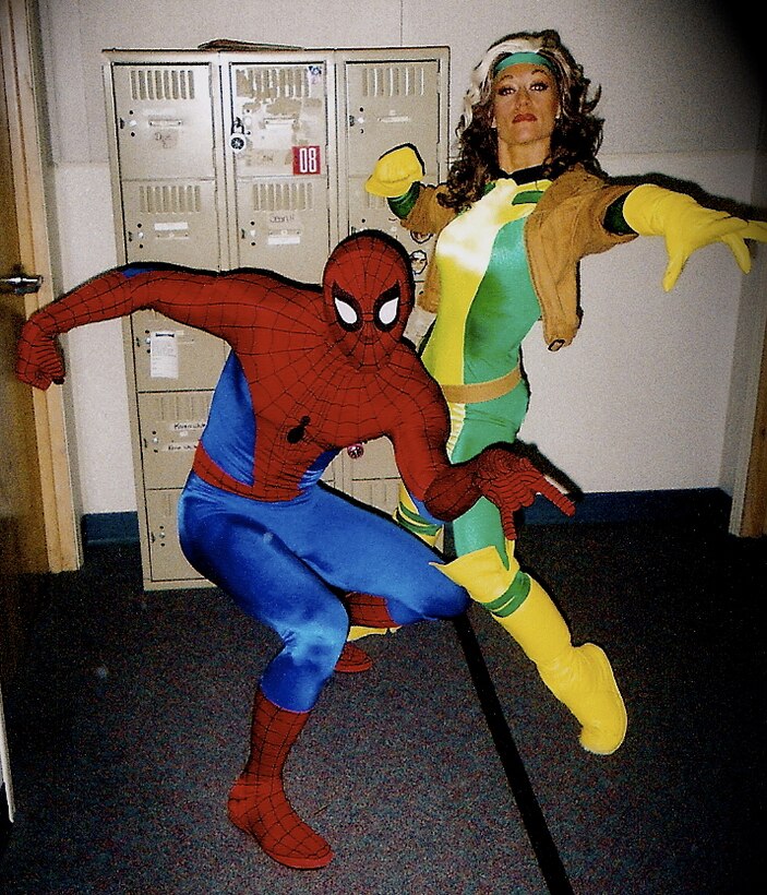 Scott T. Wilson (left), a native of Orlando, Fla., poses as Spider-man next to his wife, Babette, who played Rogue for a live-action, Marvel super hero show at Universal Studios theme park in Florida. Wilson, now a Marine first lieutenant serving as a comptroller with the Command Element, 31st Marine Expeditionary Unit, was an accomplished stunt actor and performer who worked in films, television and theme parks before joining the Marines in 2011. 