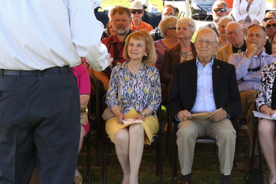 Mitchel Raftelis, former Quantico mayor, and his wife, Georgia, listen to Kevin Brown, the current Town of Quantico mayor, speak during the dedication of the Raftelis Potomac River Park at 408 River Rd. in the town of Quantico, on April 26, 2014. The park was named for Raftelis and his wife, Georgia. Raftelis was mayor from July 1998- 2006. 