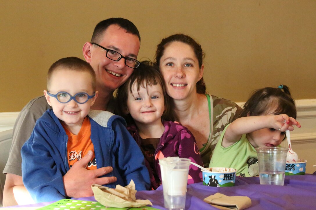 Sgt. Brian Murphy, his wife Kristy, and their three children, Owen, left, 5, Alana, 3, and Eva, 2, participate in the Lyman Park Community block party at the Lincoln Military Housing Family Center on April 22, 2014. More than 400 Lyman Park residents participated in the event which was one of six 2014 Quantico community block parties. 