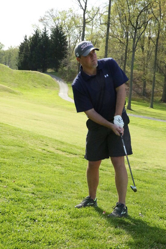 Jose Padin, golfer, hits a golf ball in an attempt to land it on the green during the Putt for the Paw Golf Tournament at the Medal of Honor Golf Course on April 25, 2014. The event was hosted by the golf course and the Washington, D.C., chapter of Pets for Vets organization. 