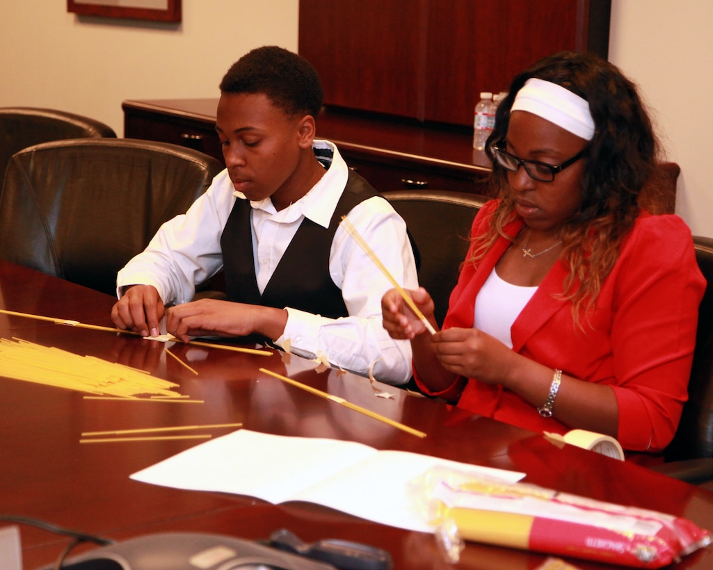 Walter and Dominique Washington construct a spaghetti bridge during the 21st Annual Take Our Daughters And Sons To Work® program held at the district offices in Los Angeles April 24. Nearly two dozen children of U.S. Army Corps of Engineers Los Angeles District employees participated in the event.