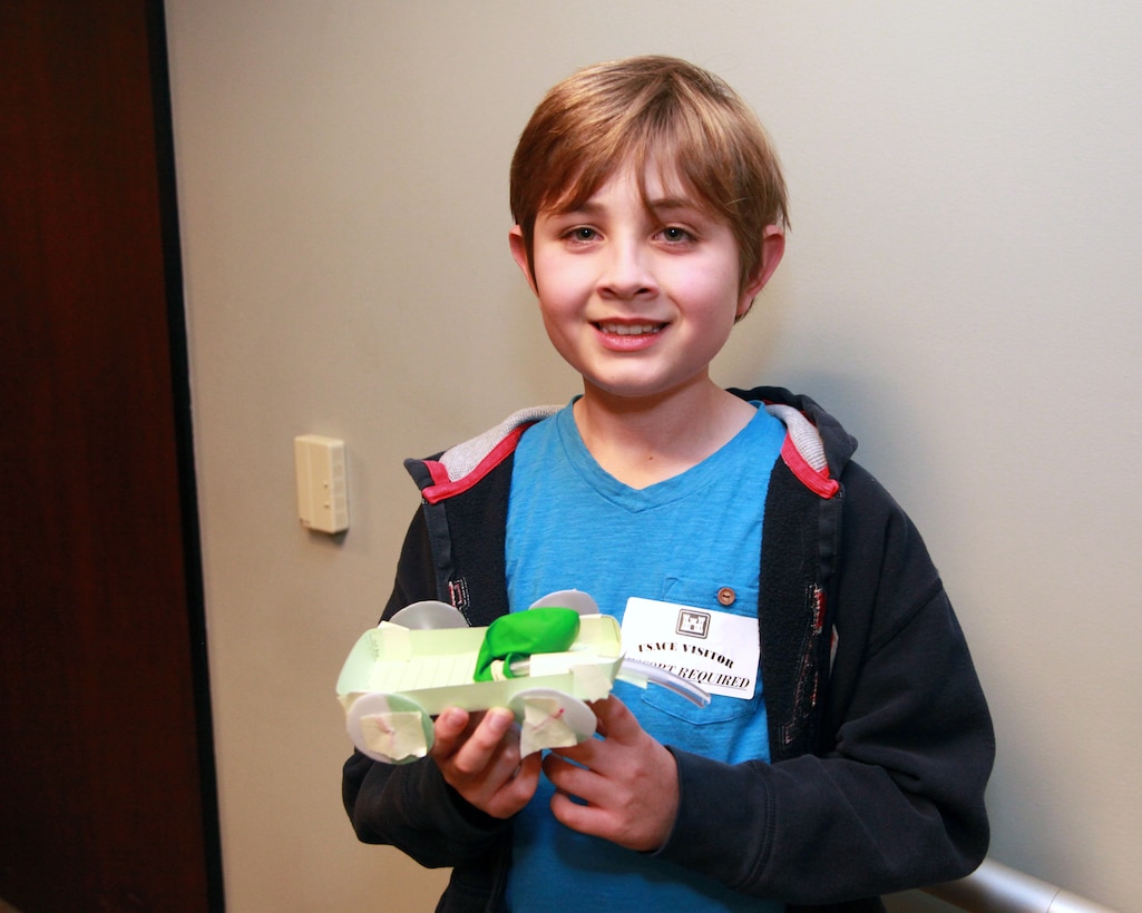 William MacNeil shows off the balloon-powered car he built during the 21st Annual Take Our Daughters And Sons To Work® program held at the district offices in Los Angeles April 24. Nearly two dozen children of U.S. Army Corps of Engineers Los Angeles District employees participated in the event.