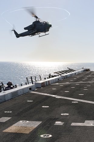 Maj. John B. Parker, AH-1W Super Cobra pilot with Marine Light Attack Helicopter Squadron (HMLA) 269, and Frankfurt, Ky., native, and Capt. Scott R. Neidecker, co-pilot with HMLA-269 and Gulfport, Miss., native, prepare to land an AH-1W Super Cobra aboard the USS New York (LPD 21) flight deck off the shore of Jacksonville, Fla., April 26, 2014, during the ship’s departure to South Florida. Approximately 120 Marines from HMLA-269, Marine Corps Air Station New River, N.C., 2nd Assault Amphibian Battalion, and 2nd Battalion, 6th Marine Regiment, 2nd Marine Division, Marine Corps Base Camp Lejeune, N.C., are participating in the 24th annual Fleet Week in Port Everglades, South Florida’s annual celebration of maritime forces. (U.S. Marine Corps photo by Sgt. Alicia R. Leaders/Released)