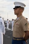 Lance Cpl. Austin L. Barnett, native of Texarkana, Texas, and amphibious assault vehicle crew chief with 2nd Assault Amphibian Battalion, 2nd Marine Division, Marine Corps Base Camp Lejeune, N.C., stands at parade rest with fellow Marines and Sailors while manning the rails as the USS New York (LPD 21) sails into South Florida for Fleet Week Port Everglades 2014, April 28. Approximately 120 Marines from 2nd AAV Bn., 2nd Battalion, 6th Marine Regiment, 2nd Marine Division, Marine Corps Base Camp Lejeune, N.C., and Marine Light Attack Helicopter Squadron (HMLA) 269, Marine Corps Air Station New River, N.C., are participating in the 24th Annual Fleet Week in Port Everglades; South Florida’s annual celebration of maritime forces. (U.S. Marine Corps photo by Sgt. Alicia R. Leaders/Released)