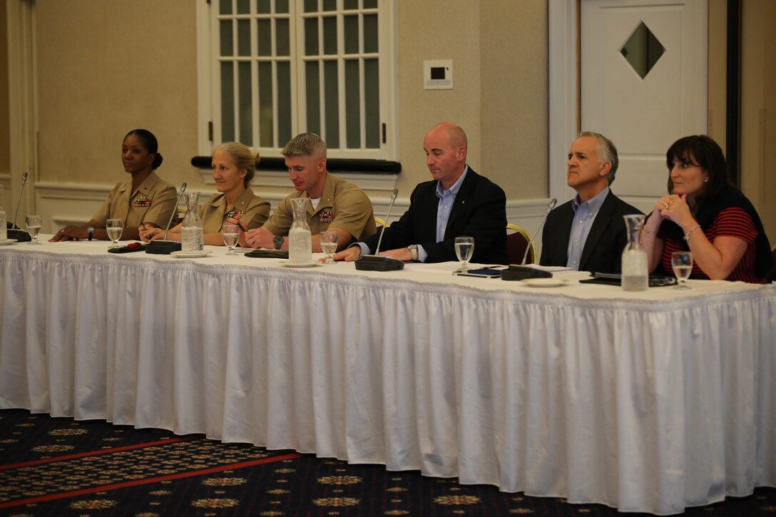 From left to right, Chief Warrant Officer 5 Sequoia Aldridge, the personnel officer in the Manpower Information Systems Division of Manpower and Reserve Affairs, Col. Robin Gallant, the commanding officer for Headquarters and Service Bn., Maj. Ben Wagner, the Professional Programs branch head at the Marine Corps University, Seth Lapine, a former Marine major and the owner and vice president of retail sales and marketing for Lapine Associates Inc., Robert Stanko, the executive vice president and general manager of Hartford Technologies and Robin Imbrogno, the president and chief operating officer of The Human Resource Consulting Group, formed a panel of Marines and civilians who discussed leadership during a Marine Corps Leadership Seminar event at the Clubs at Quantico on April 25, 2014. The panel talked about the difference between leadership and management and how they are used in the workplace.