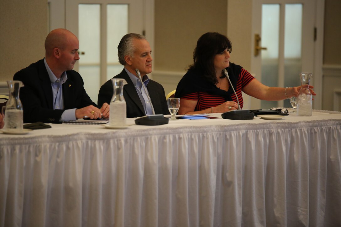 From left to right, Seth Lapine, a former Marine major and the owner and vice president of retail sales and marketing for Lapine Associates Inc., Robert Stanko, the executive vice president and general manager of Hartford Technologies and Robin Imbrogno, the president and chief operating officer of The Human Resource Consulting Group, formed the civilian side of a panel with Marine leaders who discussed leadership during a Marine Corps Leadership Seminar event at the Clubs at Quantico on April 25, 2014. The panel talked about the difference between leadership and management and how they are used in the workplace.