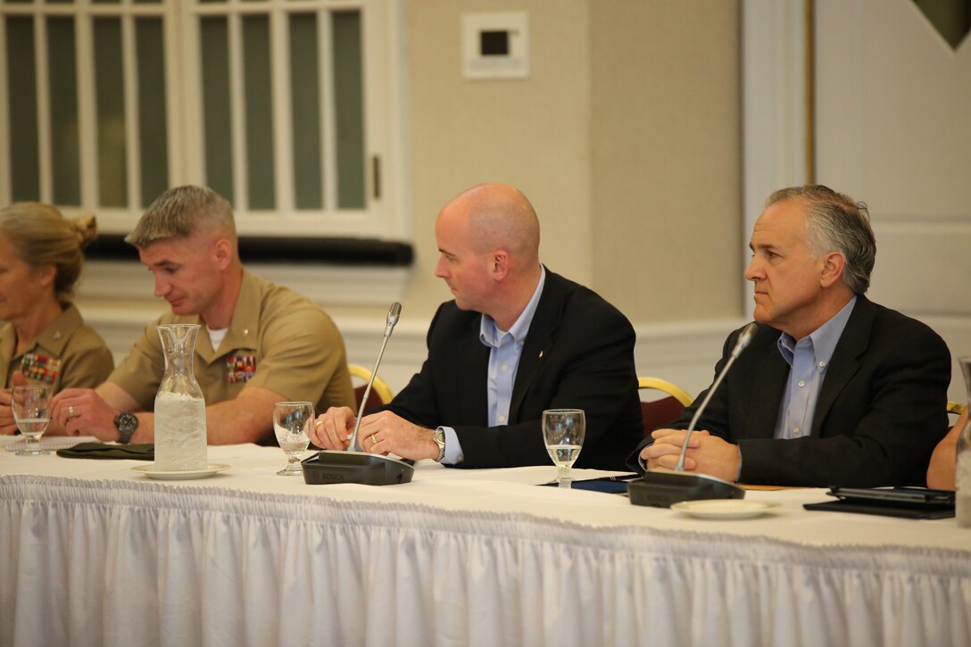 From left to right, Maj. Ben Wagner, the Professional Programs branch head at the Marine Corps University, Seth Lapine, a former Marine major and the owner and vice president of retail sales and marketing for Lapine Associates Inc. and Robert Stanko, the executive vice president and general manager of Hartford Technologies, were part of a panel that discussed leadership during a Marine Corps Leadership Seminar event at the Clubs at Quantico on April 25, 2014. The panel talked about the difference between leadership and management and how they are used in the workplace.