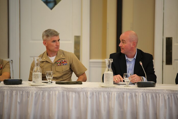 Maj. Ben Wagner, the Professional Programs branch head at the Marine Corps University, and Seth Lapine, a former Marine major and the owner and vice president of retail sales and marketing for Lapine Associates Inc. were a part of a panel made up of Marine and civilian leaders who discussed leadership during a Marine Corps Leadership Seminar event at the Clubs at Quantico on April 25, 2014. The panel talked about the difference between leadership and management and how they are used in the workplace.