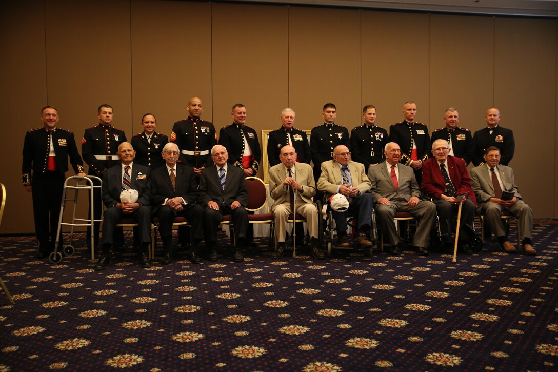 Members of the 1st Marine Raider Battalion sit in front of active duty Marines from Marine Corps Base Quantico during during the 66-year reunion at the Clubs of Quantico on April 26, 2014. Eight Marine Raiders attended the event to celebrate their accomplishments and to remember their brother Raiders.