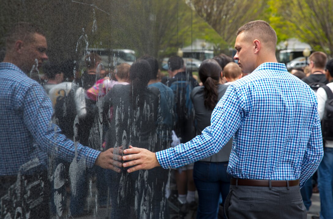 Cpl. Justin Skolek, calibrator with Marine Aviation Logistics Squadron 16 and an El Paso, Ill., native, walks along the Korean War Veterans Memorial in Washington, D.C., during a Committed and Engaged Leadership Seminar, April 25.  Fifty-two Marines with the 3rd Marine Aircraft Wing attended the seminar. 