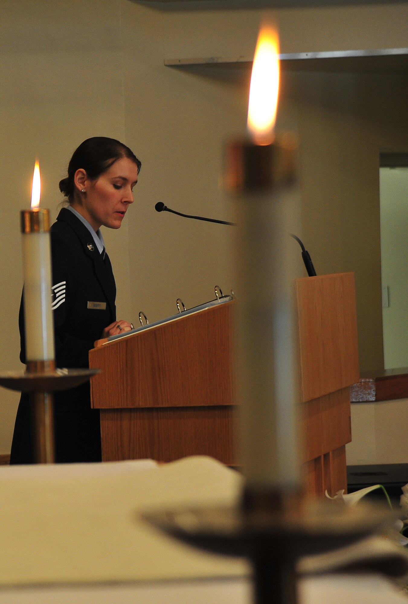 U.S. Air Force Tech. Sgt. Brooke Scott, 35th Fighter Wing professional development center coordinator, speaks to attendees of the Holocaust Remembrance Candlelight Vigil at Misawa Air Base, Japan, April 28, 2014. As part of Holocaust Remembrance Week, Airmen gathered at the base chapel to pay respect to those persecuted and massacred between 1933 and 1945 by Germany’s Nazi regime. (U.S. Air Force photo/Senior Airman Jose L. Hernandez-Domitilo)