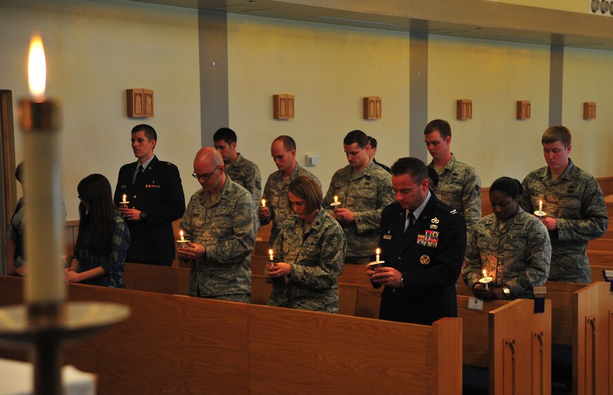 Airmen hold a moment of silence in remembrance of the Holocaust victims during a candlelight vigil at Misawa Air Base, Japan, April 28, 2014. Airmen also paid respect to victims all around the world who have and are currently suffering from religious and social persecution. (U.S. Air Force photo/Senior Airman Jose L. Hernandez-Domitilo)