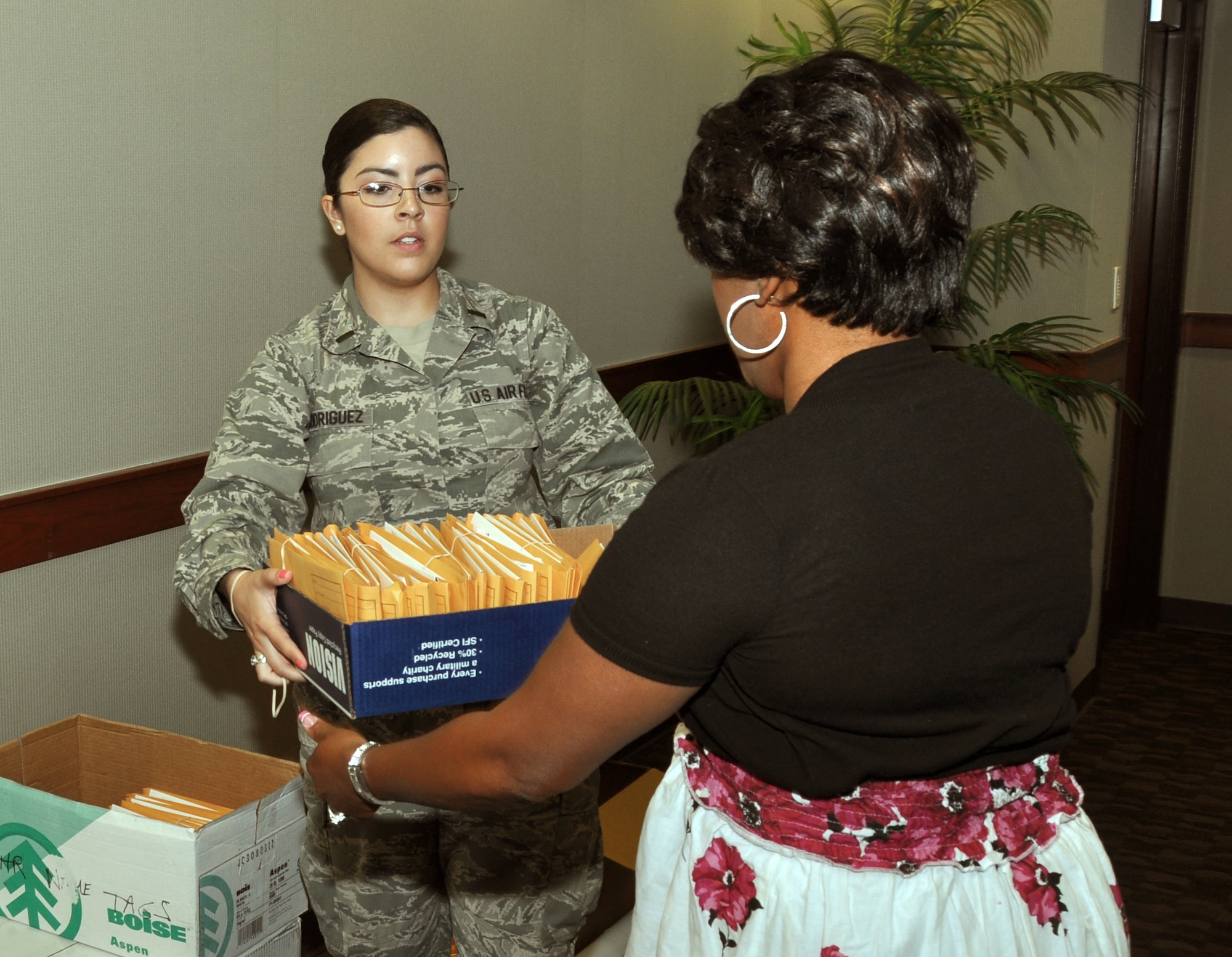 GOODFELLOW AIR FORCE BASE, Texas - First Lt. Pricilla D. Rodriguez, 17th Mission Support Group executive, hands Yalonda G. Folks, 17th Training Support Squadron International Military Student Officer chief, her C.W. Bill Young DOD Marrow Donor Program drive collection kits in the wing conference room here April 24. Folks said that she would like to get 100 percent participation within her squadron. (U.S. Air Force photo/ Senior Airman Joshua Edwards)