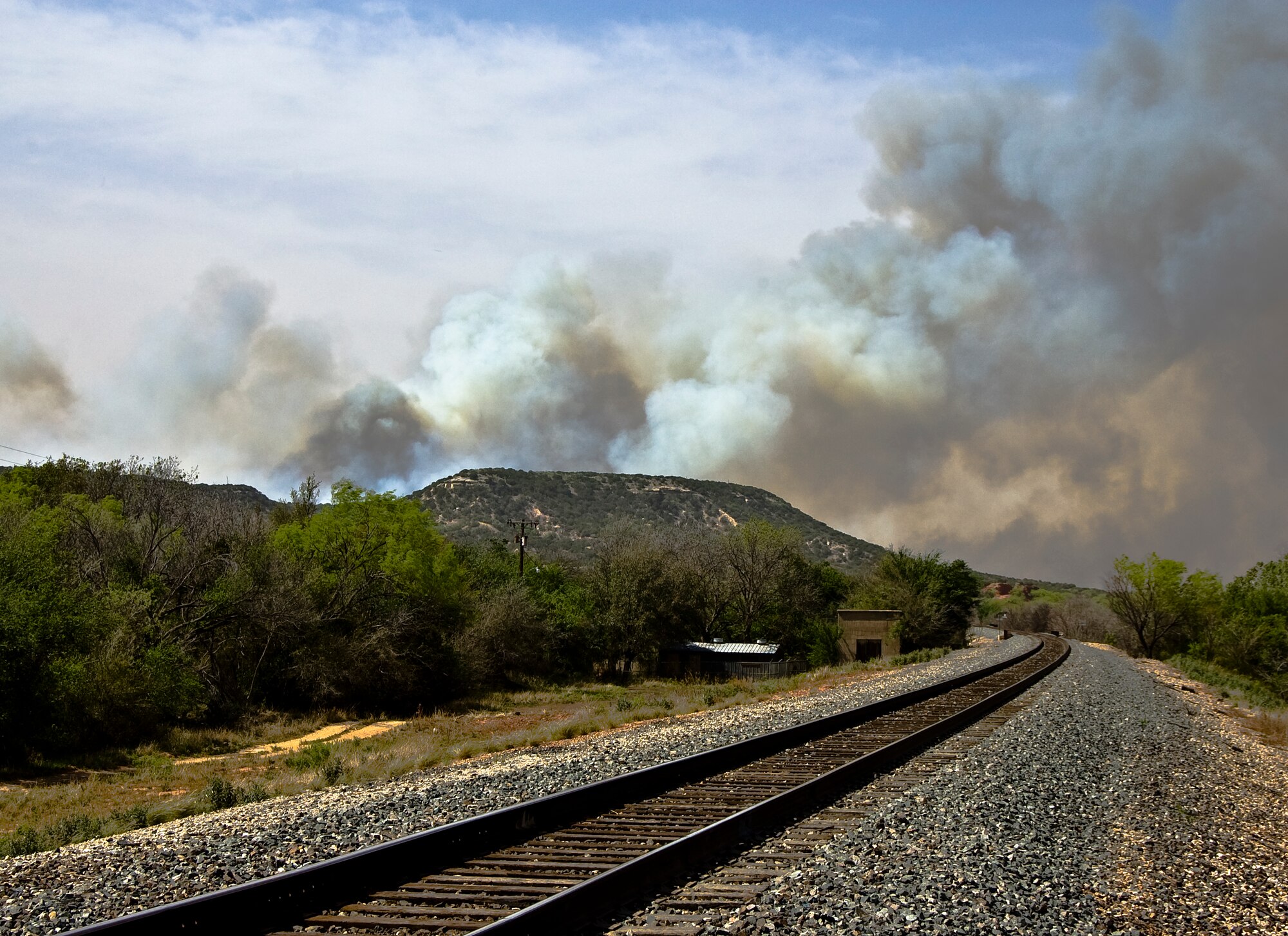 The Dyess Air Force Base Fire Department and other Big Country fire departments joined forces to contain a 1,600 acre wildfire April 27, 2014, at Camp Barkeley near Buffalo Gap, Texas. Dyess fire crews arrived on scene in about 45 minutes with two brush trucks. Camp Barkeley is located approximately 15 miles south of Dyess AFB. (U.S. Air Force photo by Staff Sgt. Richard Ebensberger/Released)