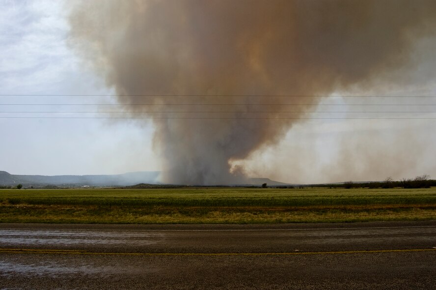 The Dyess Air Force Base Fire Department assisted local fire departments during a 1,600 acre wildfire April 27, 2014, at Camp Barkeley near Buffalo Gap, Texas. High winds added to the fire’s strength with wind gusts reaching more than 50 miles per hour. Dyess maintains a mutual aid agreement with the surrounding local fire departments which allows them to assist each other during emergencies such as this. (U.S. Air Force photo by Staff Sgt. Richard Ebensberger/Released)