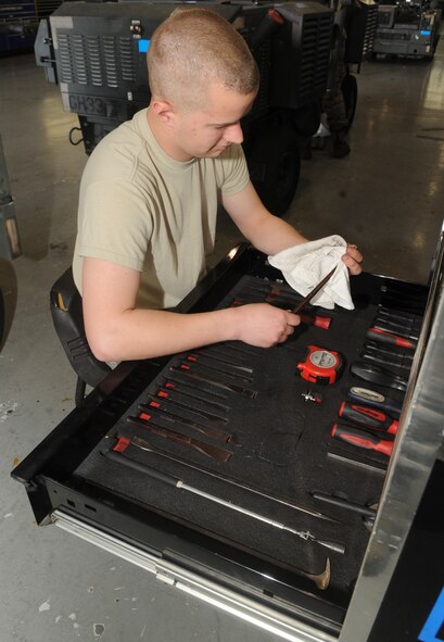 Airman 1st Class Thomas Wierzchowski, 2nd Maintenance Squadron Aerospace Ground Equipment, inspects tools for defects on Barksdale Air Force Base, La., April 29, 2014. Each tool is cleaned and properly stored for continuous use during AGE Airmen's maintenance tasks. (U.S. Air Force photo/Senior Airman Kristin High)