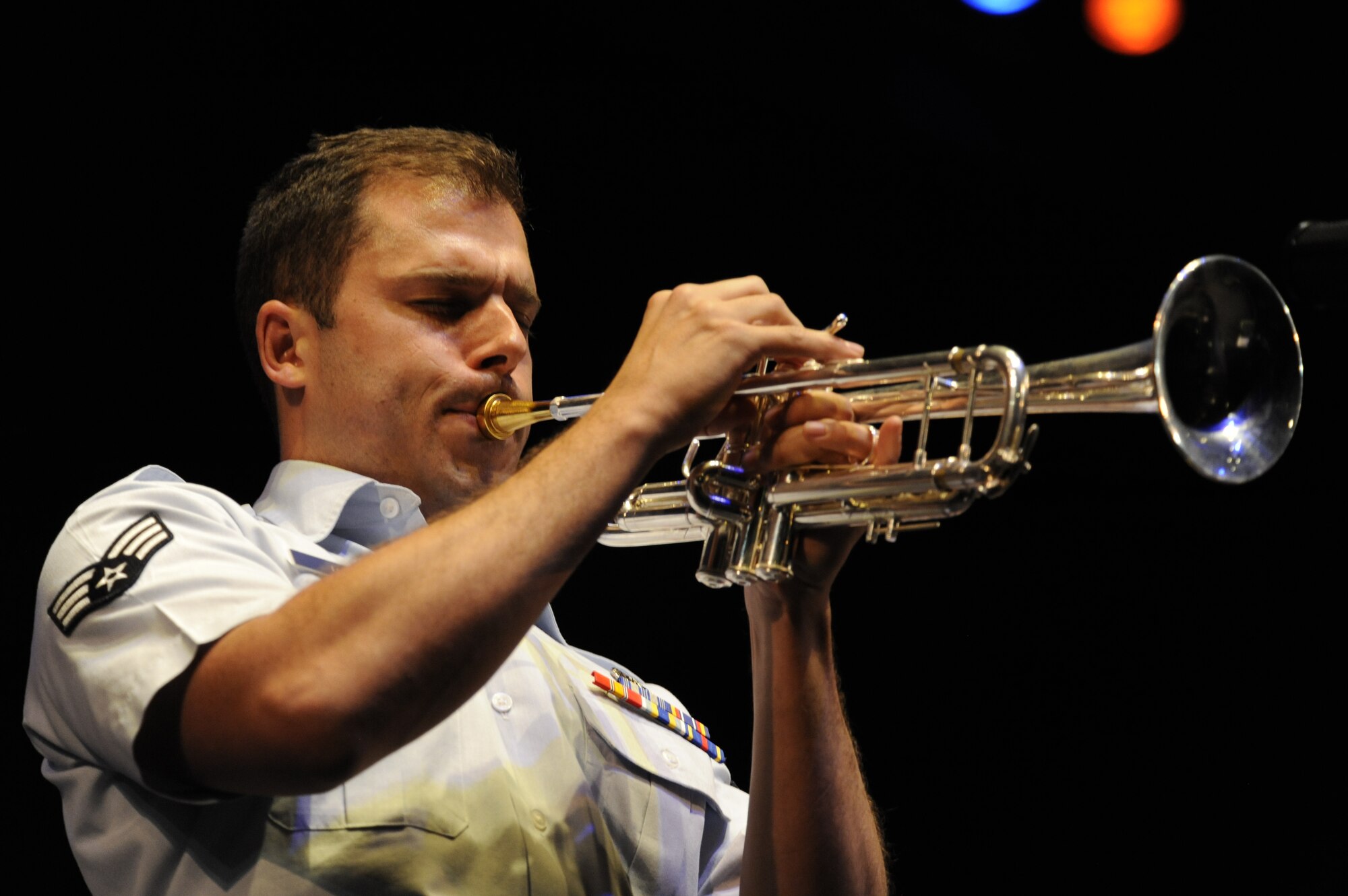 U.S. Air Force Senior Airman Benjamin Paille, U.S. Air Force Band of the Golden West trumpet player, plays during a free concert at the Fox Tucson Theatre in Tucson, Ariz., April 27, 2014. The band supports 13 Air Force Bases, 8 Air Force Reserve Wings, and 6 recruiting squadrons in over 250 annual performances for 1.5 million listeners. (U.S. Air Force photo by Airman 1st Class Betty R. Chevalier/Released)