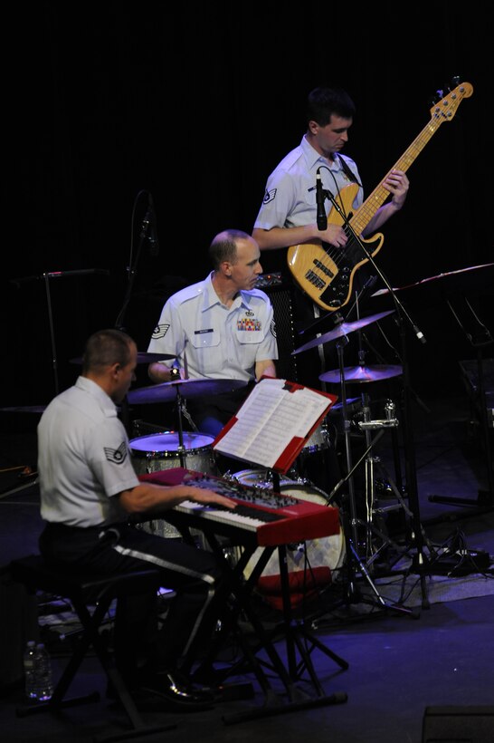 Members of The Commanders Jazz Ensemble perform during a free concert at the Fox Tucson Theatre in Tucson, Ariz., April 27, 2014.The ensemble included saxophone, trombone, trumpet, bass, keyboard and drums. (U.S. Air Force photo by Airman 1st Class Betty R. Chevalier/Released)