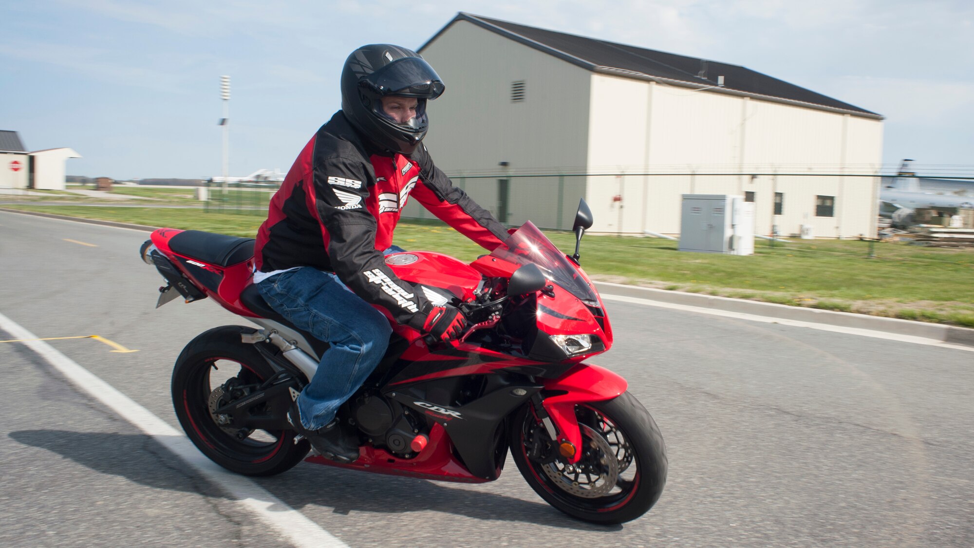 Tech. Sgt. Matthew Hollowell, 436 Civil Engineer Squadron electrical power production craftsmen, rides during Motorcycle Safety Day April 25, 2014, on Dover Air Force Base, Del. Hollowell is a motorcycle ridercoach with the base as well as a member of the Motorcycle Safety Day planning committee. (U.S. Air Force photo/Senior Airman Jared Duhon)