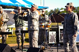 The U.S. Air Force Full Spectrum band performs during the Warrior Run 5k and 10k event at Fort Eustis, Va., April 26, 2014. More than 200 runners participated in the runs, and an additional 217 volunteers set up and executed the event activities. (U.S. Air Force photo by Senior Airman Austin Harvill/Released) 