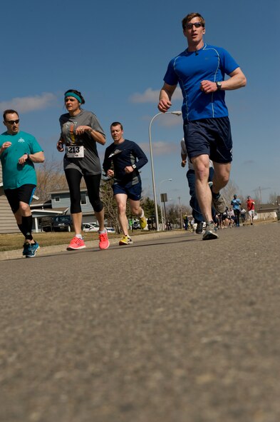 Airmen and families from the 5th Medical Group participate in the Mighty Medic Meltdown Run at Minot Air Force Base, N.D., April 25, 2014. This event was hosted by the 5th MDG to raise awareness for child abuse and sexual assault prevention. (U.S. Air Force photo/Senior Airman Malia Jenkins)