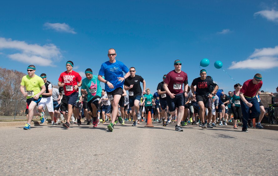 Airmen and their families begin the Mighty Medic Meltdown Run at Minot Air Force Base, N.D., April 25, 2014. Participants had the option to run a 5K or 10Krace, which was held to raise awareness for child abuse and sexual assault prevention during the month of April. (U.S. Air Force photo/Airman 1st Class Sahara L. Fales)