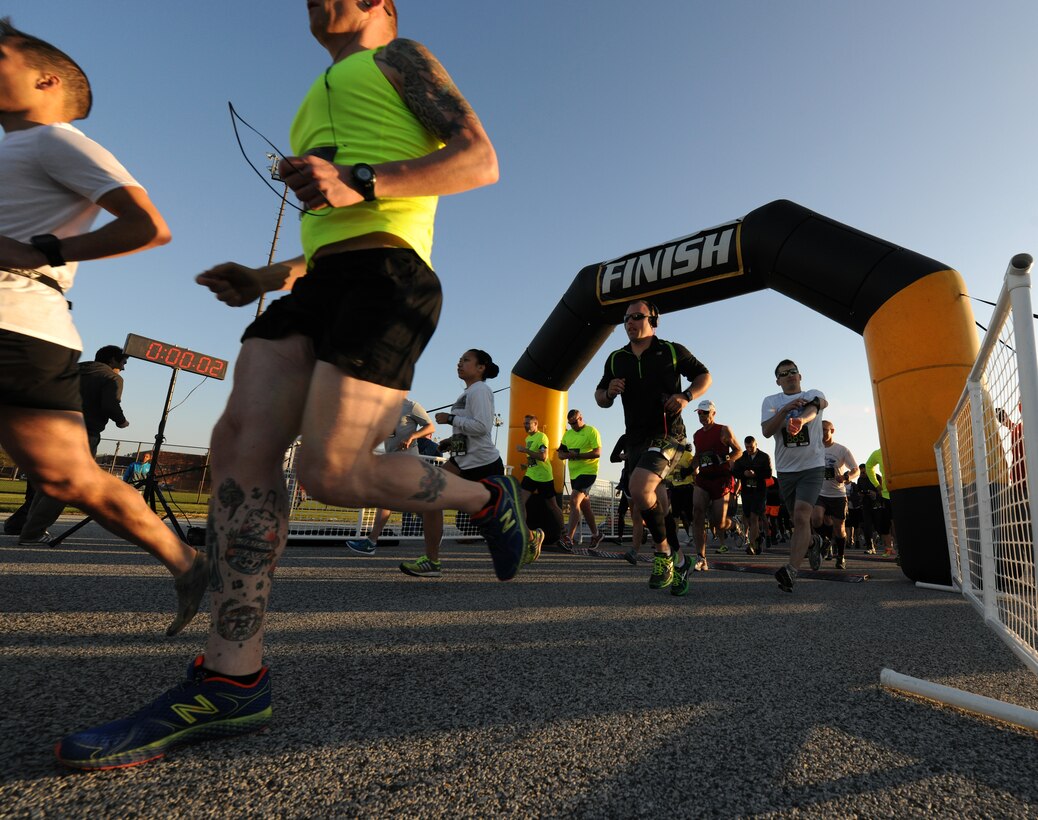 Joint Base Andrews Half Marathon participants take off running to start of the 13.1 mile race here April 26, 2014. The event represented every military branch in the National Capital Region including enlisted, officer and civilians. (U.S. Air Force photo/Senior Airman Nesha Humes)