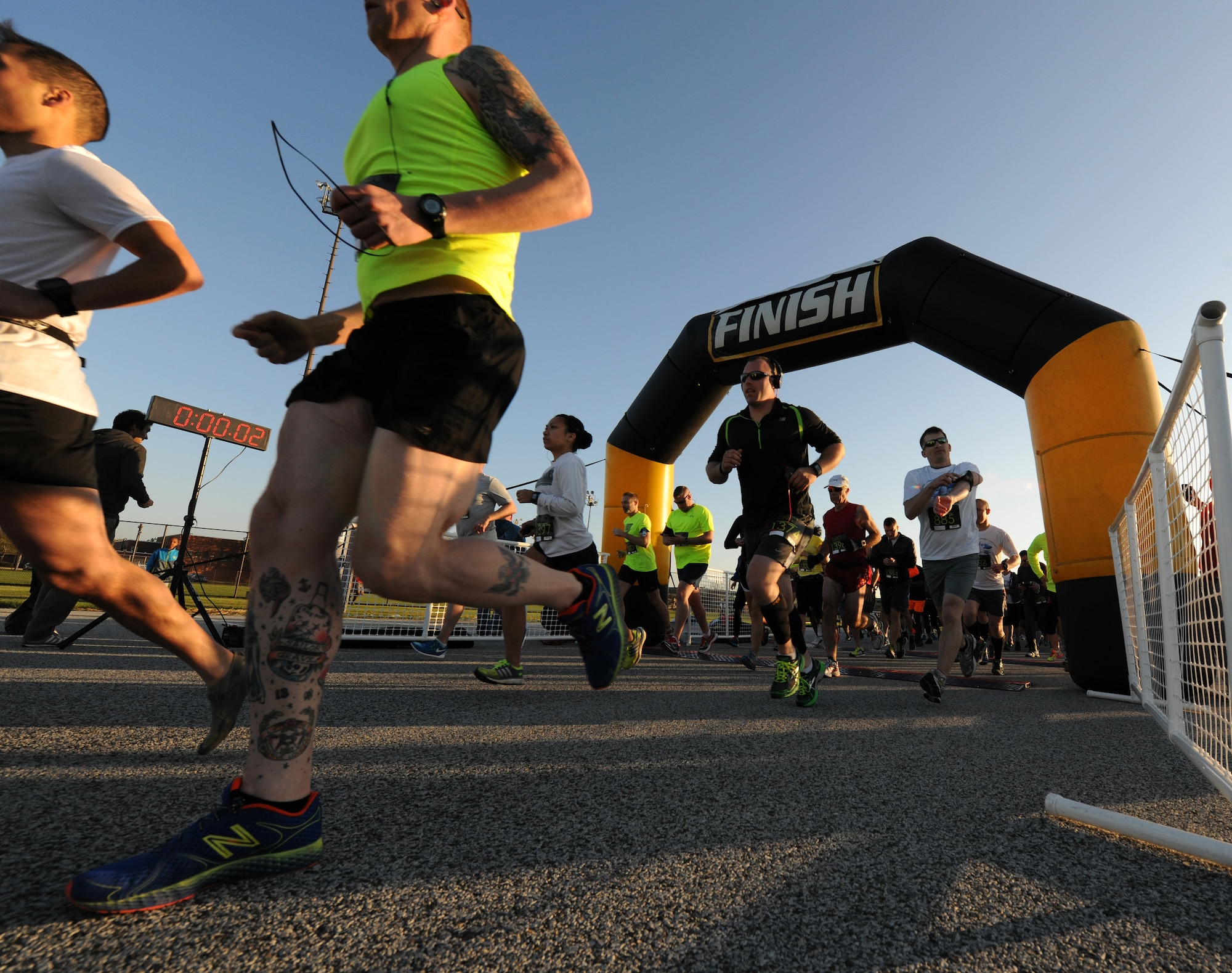Joint Base Andrews Half Marathon participants take off running to start of the 13.1 mile race here April 26, 2014. The event represented every military branch in the National Capital Region including enlisted, officer and civilians. (U.S. Air Force photo/Senior Airman Nesha Humes)