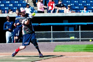 Nick Clark, a U.S. Army veteran and Wound Warrior Amputee Softball team player, takes a swing during the 2nd annual Spartyka Wounded Warrior Softball Classic at Harbor Park in Norfolk, Va., April 26, 2014. The amputee team is comprised of U.S. Army, Air Force, Navy or Marine Corps veterans who suffered an amputation of the arm, legs or foot, while serving in the military after 9/11. (U.S. Air Force photo by Senior Airman R. Alex Durbin/Released)