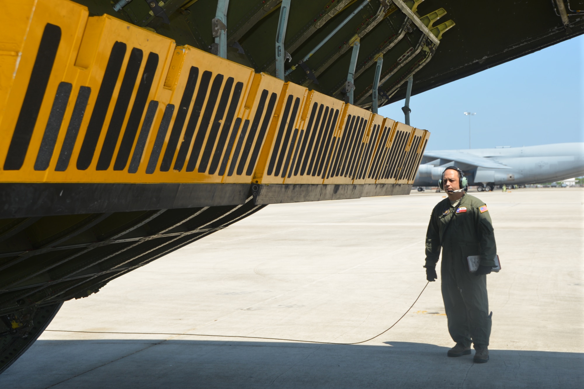 Master Sgt. Freddie Kondoff, loadmaster, 68th Airlift Squadron, Joint Base San Antonio-Lackland, Texas scans the aft door of a C-5A Galaxy aircraft to ensure it properly closes, before take-off to Naval Air Station, North Island, Calif., 24 April, 2014. 433rd aircraft participated in the Air Force Reserve Command’s Patriot Hook 2014 exercise. Patriot Hook is an annual Air Force Reserve Command sponsored exercise that integrates federal agencies with the military, which focuses on making the most of command and support, training, integration and practicing mobilizations to disasters and emergencies. (U.S. Air Force photo/Senior Master Sgt. Minnie Jones)
