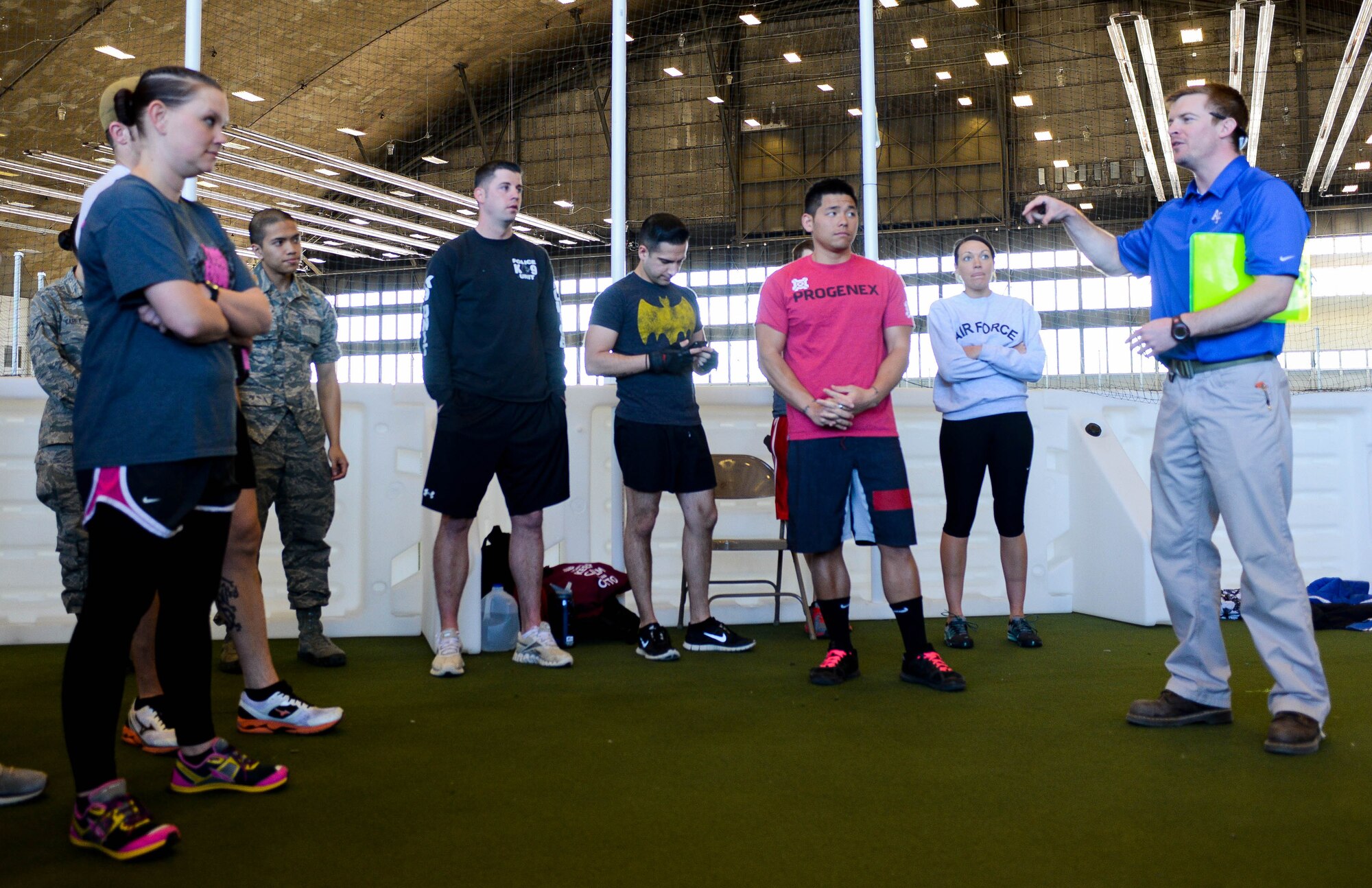 Brandon Powers, 28th Medical Group Health and Wellness Center exercise physiologist, explains the rules of the Sexual Assault Prevention Combat Challenge to event participants in the Pride Hangar at Ellsworth Air Force Base, S.D., April 24, 2014. The event, hosted and coordinated by the HAWC and the 28th Bomb Wing Sexual Assault Prevention and Response office, was designed to not only encourage physical fitness but raise awareness about sexual assault prevention. (U.S. Air Force photo by Senior Airman Zachary Hada/Released)