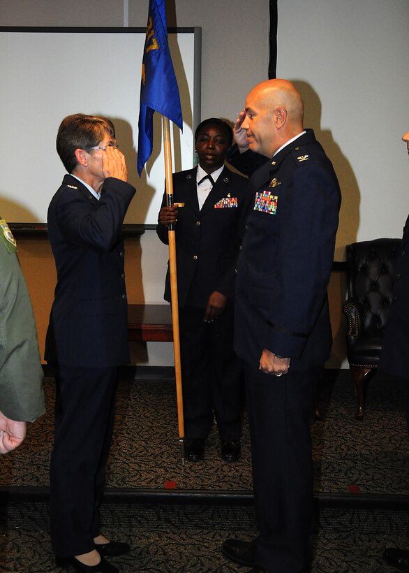 JOINT BASE CHARLESTON, S.C. -- Col. Brent Merritt, outgoing 317th Airlift Squadron commander, salutes Col. Caroline Evernham, 315th Operations Group Commander during a change of command ceremony April 28 where he relinquished command to Lt. Col. Stan Davis, former 315th Operation Support Squadron commander. Merritt is moving on to Dobbins Air Reserve Base, Georgia where he will be the new Vice Wing commander at the 94th Airlift Wing [home of the Hercules C-130H aircraft.] (Air Force Reserve Photo by Senior Airman Bobby Pilch) 