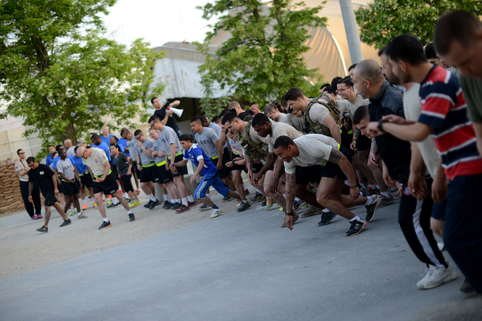 Runners take off at the start line during the 10th Annual Pat Tillman 5k run at Bagram Airfield, Afghanistan April 29, 2014.  The annual race honors Pat Tillman, a former NFL player and Army Ranger who lost his life while serving in Afghanistan in 2004.  (U.S. Air Force photo by Staff Sgt. Evelyn Chavez/Released)