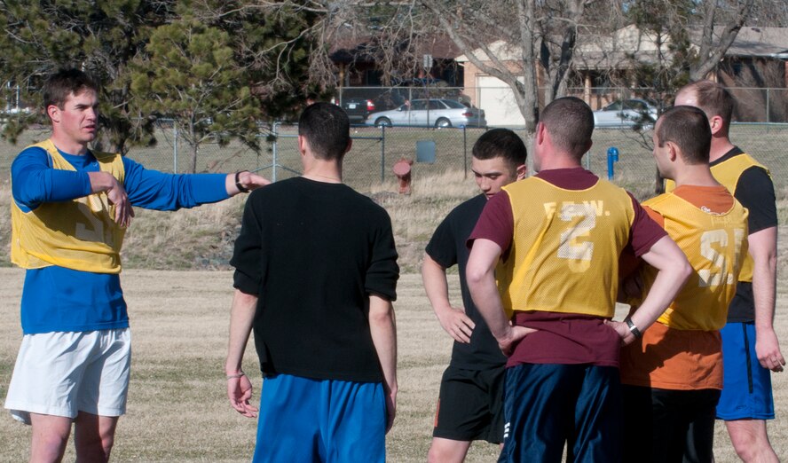Eric Wilson, 321st Missile Squadron, directs his teammates during 90th Missile Wing soccer practice team April 17 in the fields near the Freedom Hall Fitness Center. The team will have its first game May 17 at the Air Force Academy in Colorado Spring, Colo. (U.S. Air Force photo by Airman Malcolm Mayfield)