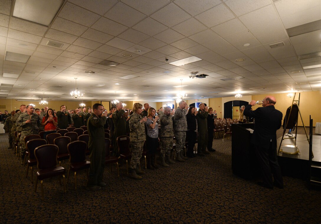 James Bower, son of Doolittle Raider Col. Bill Bower, led attendees in a toast during the Doolittle Raiders “Final Toast” at the Dakota’s Club at Ellsworth Air Force Base, S.D., April 18, 2014. Bower recounted the 72 year old seminal event, in which the Doolittle Raiders flew 16 B-25s to the coast of Japan to attack the Japanese empire in defense of the nation. (U.S. Air Force photo by Senior Airman Zachary Hada/Released)