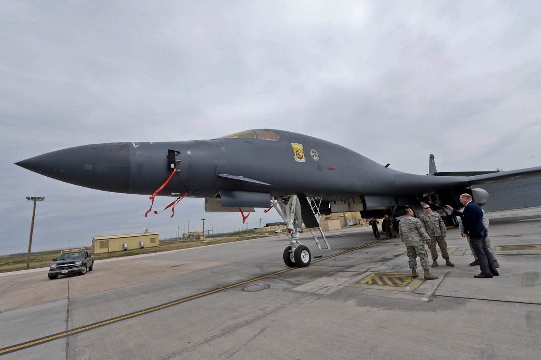 James Bower, son of Doolittle Raider Col. Bill Bower, talks to Airmen assigned to the 28th Aircraft Maintenance Squadron during a tour on the flightline at Ellsworth Air Force Base, S.D., April 18, 2014. The base is home to three of the four original units that conducted the historic raid – the 34th Bomb Squadron, 37th BS, and the 432nd Attack Squadron. (U.S. Air Force photo by Senior Airman Zachary Hada/Released)